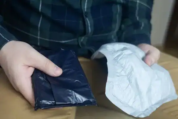 image of man holding stool incontinence  products